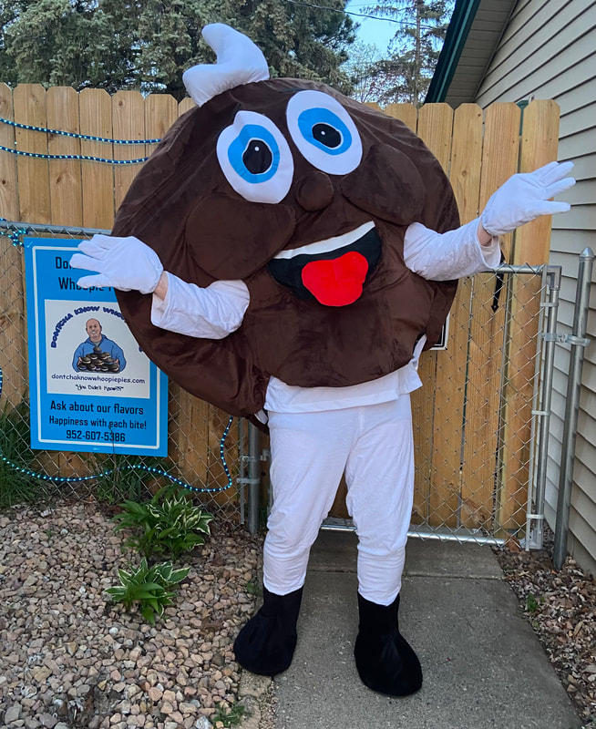 Pie, the Dontcha Know Whoopie Pies mascot, waving